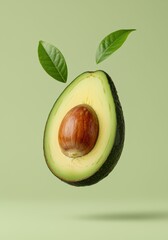 Fresh avocado with leaves on green background.