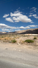 Street sign pole. cloudy sky ancient city. Narrow rock path. High quality photo