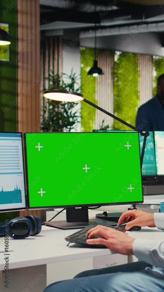 Aufkleber vertical video employee engaged in business planning with a green screen in the office, does report 