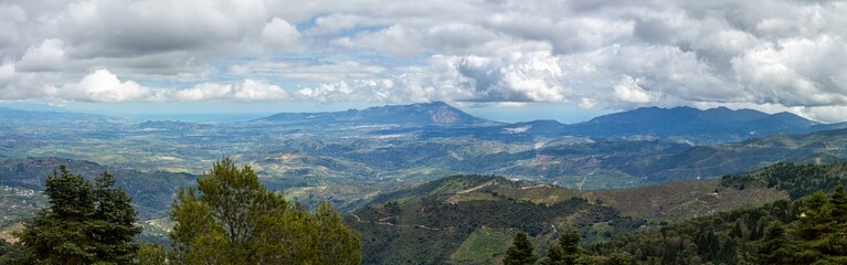 Panoramic view on Yunquera and surrunding pine forest from Puerto Saucillo viewpoint, Sierra de las Nieves national park, Andalusia, Spain