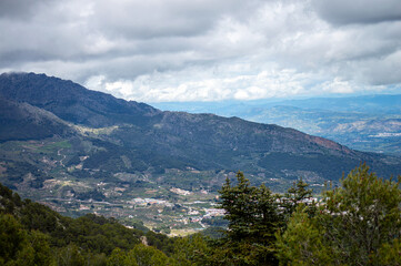 Naklejka premium Panoramic view on Yunquera and surrunding pine forest from Puerto Saucillo viewpoint, Sierra de las Nieves national park, Andalusia, Spain