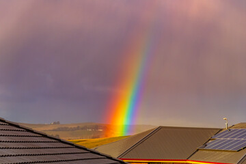 Vibrant rainbow after the rain in the sky
