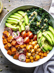 Healthy vegetable dish featuring sautéed spinach and colorful mixed vegetables, served on a rustic plate with natural lighting, ideal for clean eating and vegan food concepts.