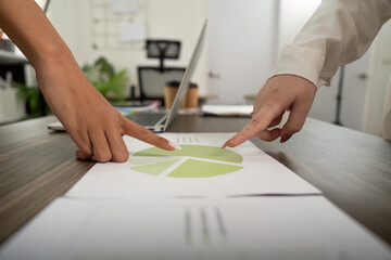 Hands Pointing at Business Chart: Team Collaboration in Office