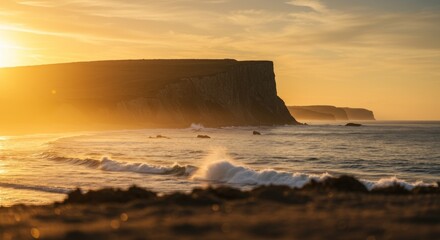 Obraz premium Golden Sunset Over Ocean Cliffs and Waves