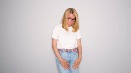 Middle aged woman sneezes unexpectedly and experiences bladder leakage. Her face shows embarrassment and discomfort, raising awareness about emotional impact it can have on daily life and confidence