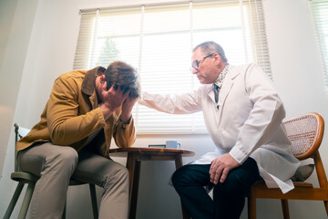 Psychiatrist doctor consulting and talking mental problem with male patient at psychiatric clinic. Depressive illness, psychologist mental health therapy, psychology and healthcare in adult people.