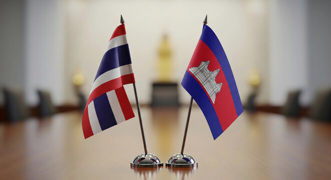 Desk flags of Thailand and Cambodia symbolizing diplomatic talks, international business, or regional cooperation. Ideal for illustrating themes of government meetings, trade agreements, and bilateral