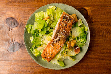 Caesar salad with grilled salmon