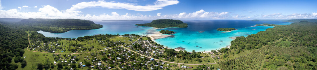 Fototapeta premium Exploring the stunning coastlines and lush landscapes of Port Olry village in Espiritu Santo, Vanuatu on a sunny day