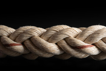 One brown braided rope isolated on black background