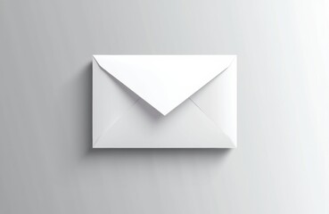A white envelope placed on a light gray background with minimalistic design