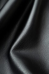 Fototapeta premium Detailed view of sleek black artificial leather featuring a subtle grain and matte surface texture
