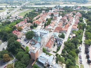 Serene Aerial View of Sandomierz Historic Old Town with a Picturesque Church and River Ideal for Website Banners, Marketing Campaigns, and Travelfocused Projects, Inspiring a Sense of.