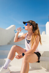 Refreshing break during a workout on a bright sunny day