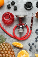 Hookah, coal and fresh fruits on grey table, flat lay