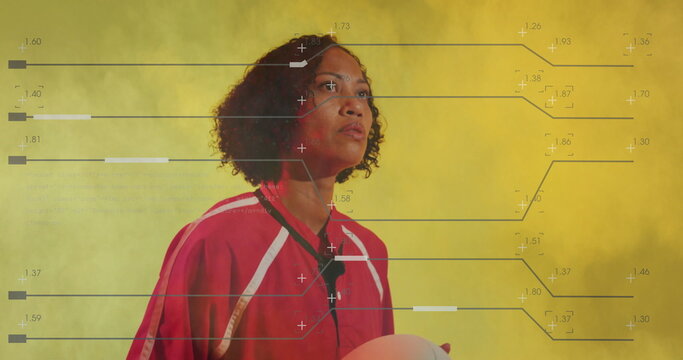 Showcasing woman in red jersey holding soccer ball at hip in yellow fog studio, analytics overlay