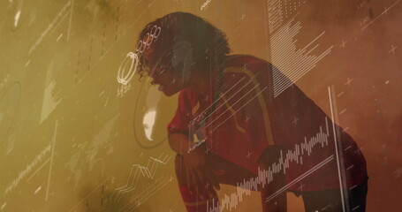 Crouching female athlete leaning on knees in training facility, with digital charts, red sportswear