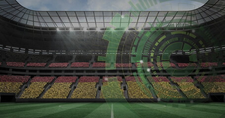 Obraz premium Showing stadium interior with lined grass pitch and block seats under glass roof, green HUD overlay
