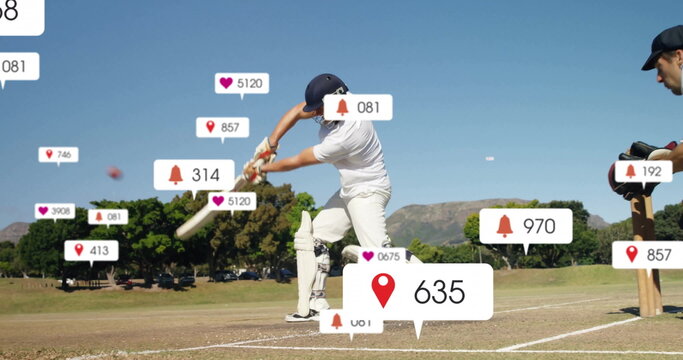 Cricket batter wearing helmet swinging bat on grass pitch with red ball, floating icons