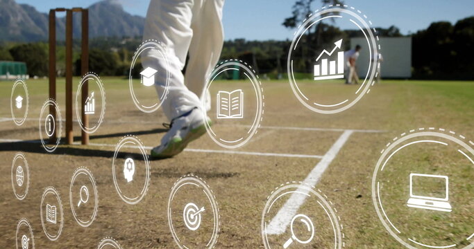Highlighting cricket batsman legs beside stumps on pitch crease, showing digital icons, copy space