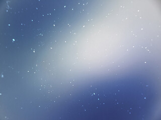 Naklejka premium Abstract background featuring a bright white and red light flare with soft bokeh on a dark canvas.