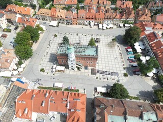 Stunning Aerial View of Historic Sandomierz Town Square Picturesque Medieval Architecture, Clock Tower, and Vibrant Buildings Perfect for Marketing Campaigns and Travel Inspiration, Evoking.