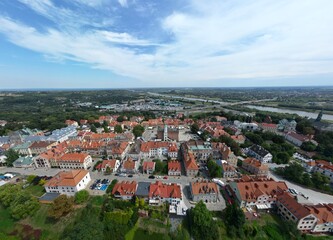 Breathtaking Aerial View of Sandomierz Historic Old Town with River and Bridge Ideal for Travel, History, and Architecture Projects, Inspiring a Sense of Timeless Elegance and Serene Beauty.