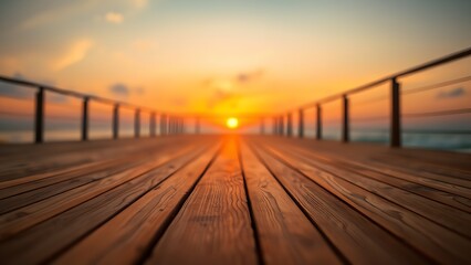 Obraz premium A wooden deck stretches toward the horizon, bathed in warm sunset light with a soft glow.