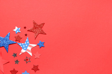 Paper stars in colors of USA flag for Independence Day on red background