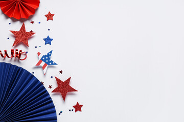 Paper fans with stars in colors of USA flag for Independence Day on white background