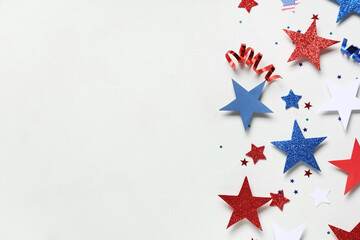 Paper stars with confetti in colors of USA flag for Independence Day on white grunge background