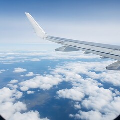 Obraz premium Airplane wing over a vast expanse of clouds.