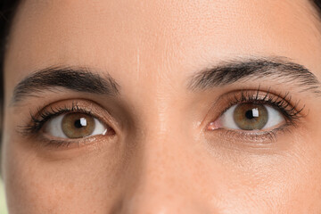 Beautiful woman with brown eyes, closeup