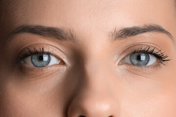 Young woman with beautiful blue eyes, closeup