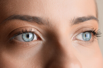 Young woman with beautiful blue eyes, closeup