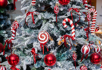 An ornaments decorated on Christmas tree during Christmas festival. Christmas tree, an evergreen tree, decorated with lights and ornaments as a part of Christmas festivities.