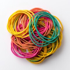 A vibrant assortment of colorful rubber bands arranged in a circular pile, each band exhibiting a unique hue 