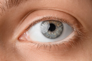Young woman with gray-blue eyes, closeup