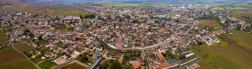 Aerial panorama view of the city Nuits-Saint-Georges in France on a sunny autumn day	