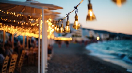 Golden sunset glow illuminating a beach restaurant with soft reflections of string lights.