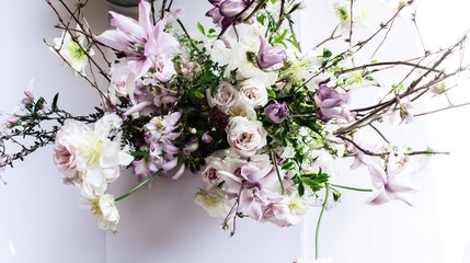 Vibrant floral arrangement captured from above on a clean white surface.