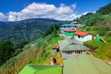 Okhrey village, Himalayan mountain range in the background . Okhrey is a remote village with breath...