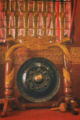 A gong is a percussion instrument originating from Southeast Asia,and used widely in Southeast Asian and East Asian musical traditions. 