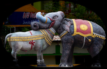 Colorful Bull and Elephant statue. One head and two bodies. Looking at one side is Bull and the other side the elephant. Replica of Dharasuram temple sculpture. Location Chennai, Tamil Nadu, India
