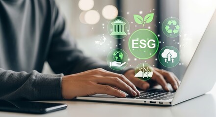 Person typing on laptop with glowing esg icons representing environmental social and governance principles
