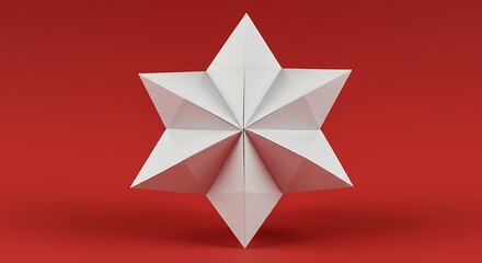 An origami fortune teller or cootie catcher made from blank white paper on a red background