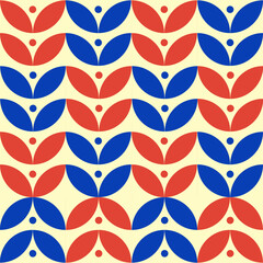 A retro geometric pattern with alternating red and blue petal shapes creating a floral motif.