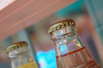 Soft drink bottles with colorful backdrop in a store