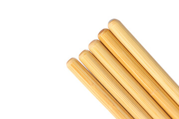 Close up of golden brown breadsticks arranged diagonally on a clean white background for a bakery advertisement